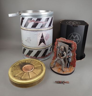 a tin with a picture of a soldier on it next to other items