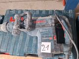 a corded drill and a corded hammer on a pallet