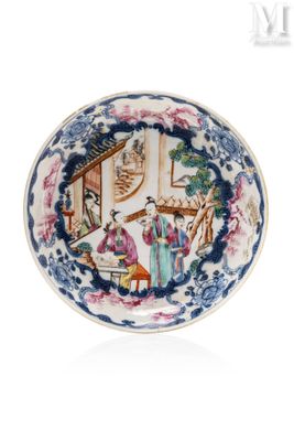 an image of a blue and white plate with a painting on it
