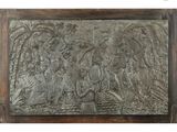 an image of a metal plaque with a picture of a group of people on it
