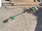 a green and black pole that is on the ground