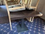 a blue carpet with a chair and a table on it