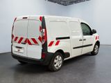 a white van with red and black stripes parked in a room