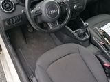 dashboard of a small car with a steering wheel and dashboard controls