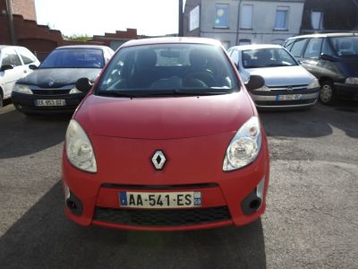 a red car that is parked in a parking lot