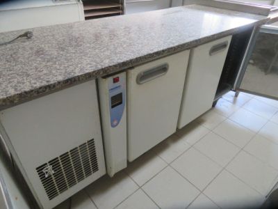 a picture of a kitchen with a refrigerator and a counter top