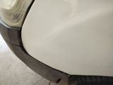a close up of a car ' s front bumper