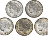 six different types of silver coins on a white background