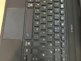 a laptop with a keyboard and mouse on a table