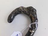 a black object with a tag attached to it