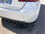 a white car that is parked in a parking lot