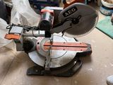 a saw that is sitting on the floor in the room