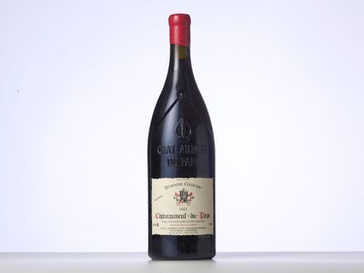 the bottle of red wine is sitting on the table