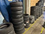 several tires are lined up on the floor in a warehouse