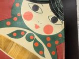a picture of a picture of a matry doll on a table