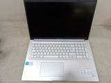 a laptop computer that is sitting on a couch