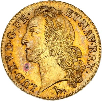 une pièce d'or ornée d'une tête de femme
