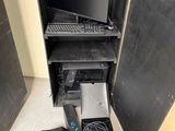a computer that is sitting inside of a cabinet