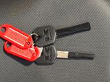 two keys that are sitting on top of each other