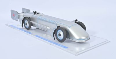 a model of a silver race car on a clear surface