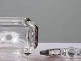 two rings and a ring holder sitting on a table