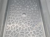 a plastic tray with a pattern on it sitting on a table