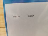 a sign that says part no g6077 on the back of a laptop