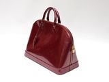 maroon leather handbag on white background with copy space for text