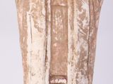 a small statue of an angel on a white background