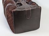 a brown bag with a handle on a white background