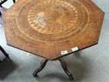 a wooden table with a wooden top and a metal base