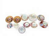 many cups and saucers that are sitting on a table