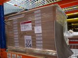 a large stack of boxes sitting on a shelf in a store