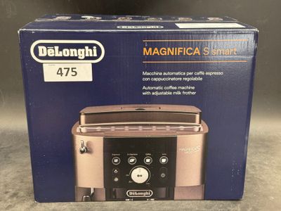 the box of a toaster is sitting on the counter