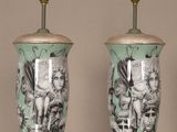 three lamps that are sitting on a glass table