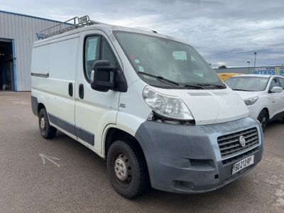 a picture of a white van parked in a parking lot