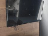 a flat screen tv mounted on a wall in a living room