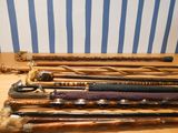 many different types of walking canes on a table