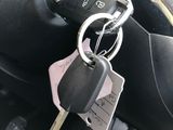 a car key that is attached to the steering wheel