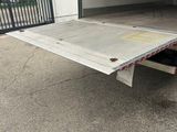 the back end of a flatbed truck with a flat bed
