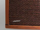 a close up of a speaker on a wall with a white background