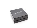 a close up of a black box on a white surface