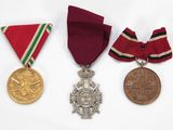 three medals and a medal on a white background