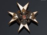 a close up of a badge on a black surface