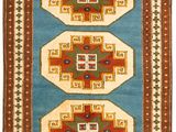 a blue and brown rug with a geometric design
