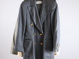 grey double breasted blazer with gold buttons on a hanger
