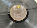an old record with a label on it sitting on top of a table