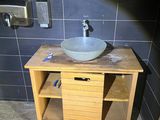 a sink and a mirror in a small bathroom