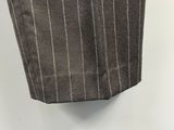 grey pinstripe pants with white stripes hanging on a wall