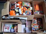 a cardboard box filled with toys and other items